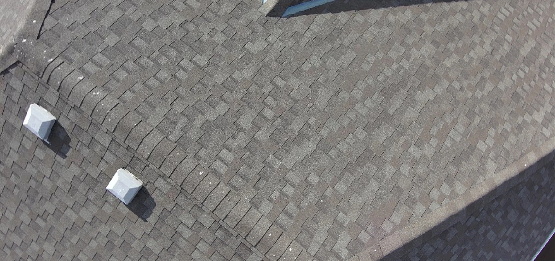 Close-up of asphalt shingles with no impact marks, Tuscany, Calgary, AB