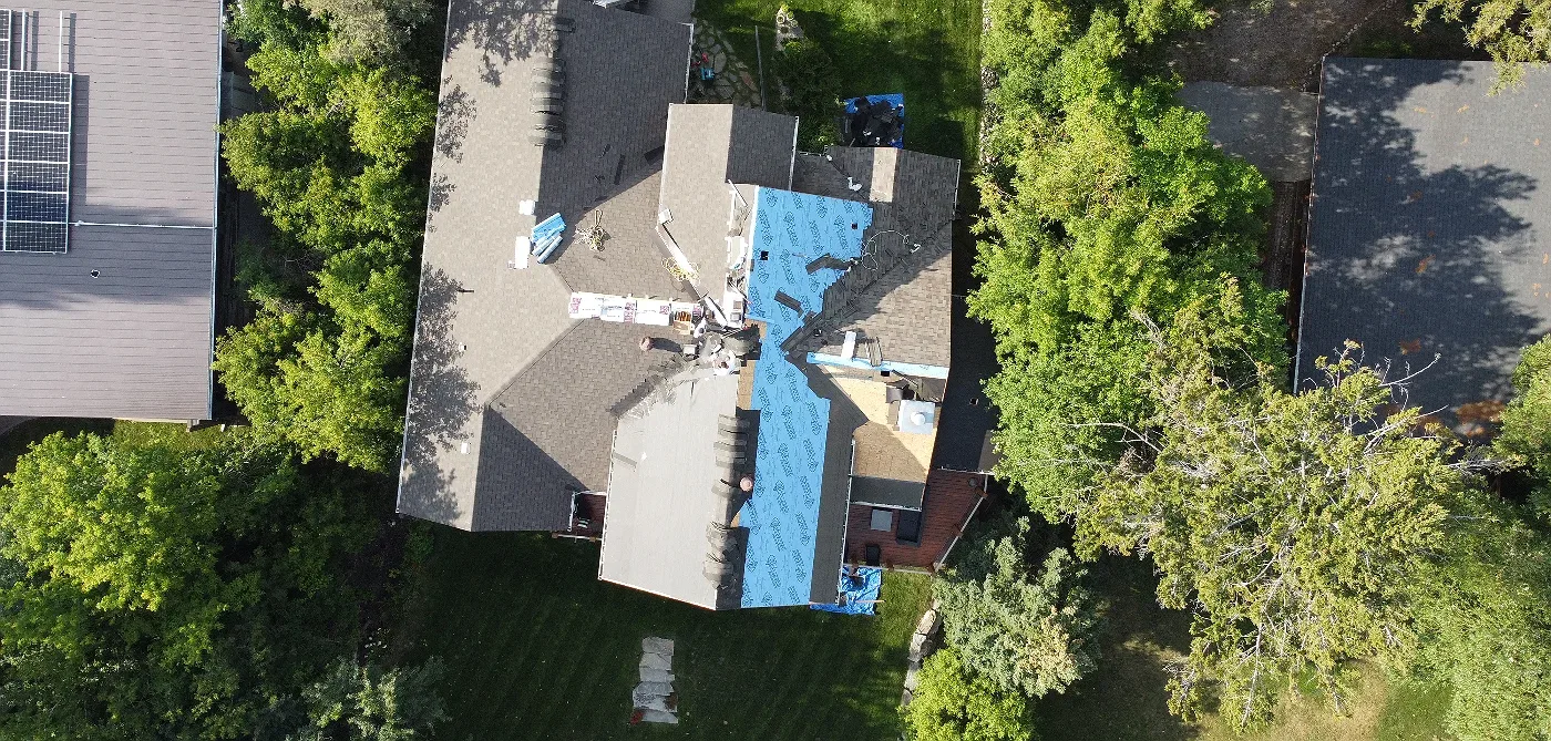Overhead view of new underlayment on a roof replacement, Windermere, BC