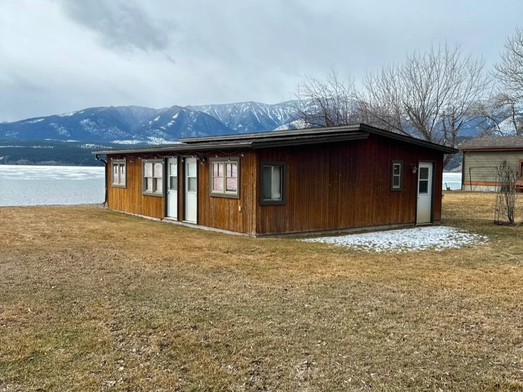 A home inspected in Windermere, BC, with the lake and mountains behind